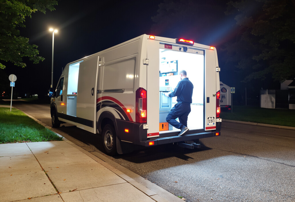 Emergency mobile locksmith working at night with a service vehicle in Charlotte, NC